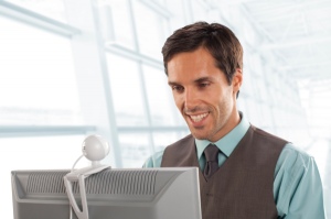 A hiring team collaborating efficiently by watching a candidate's video assessment on a shared screen.